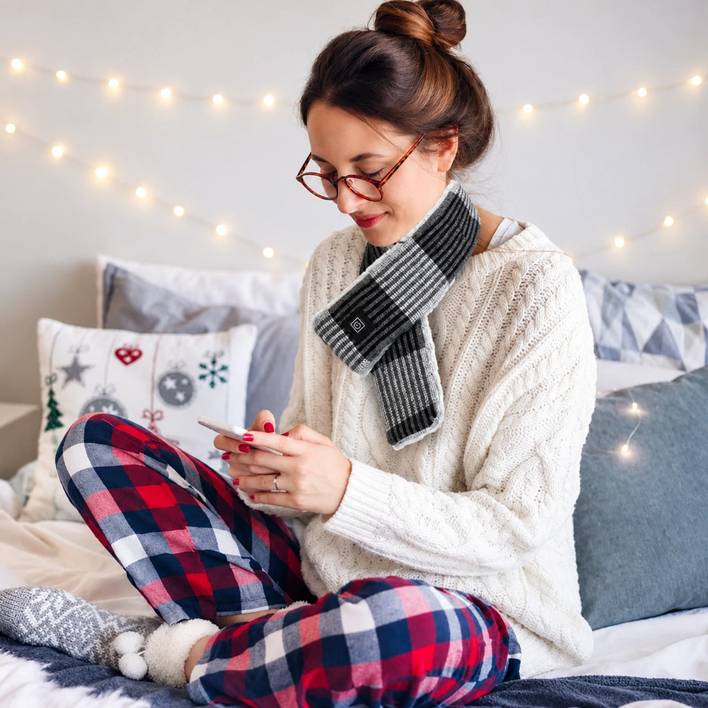 Woman wearing the USB heated scarf in dark grey at home